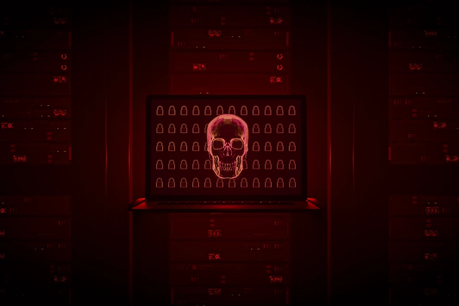 Red holographic skull hovers in front of the screen of a data center rack access console