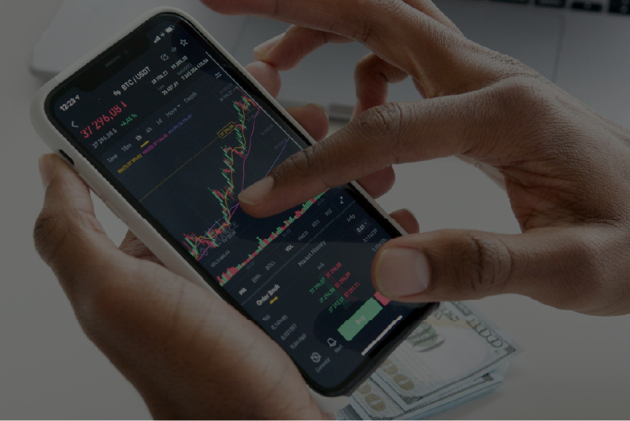 Closeup of someone using a smart phone to look at a stock chart